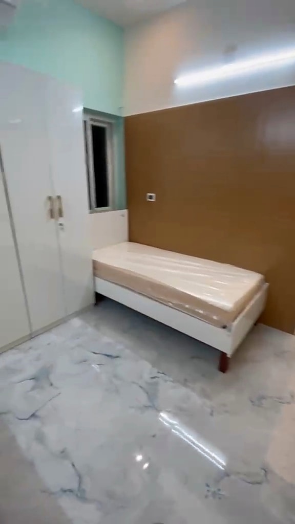 Double sharing room — bed and wardrobe